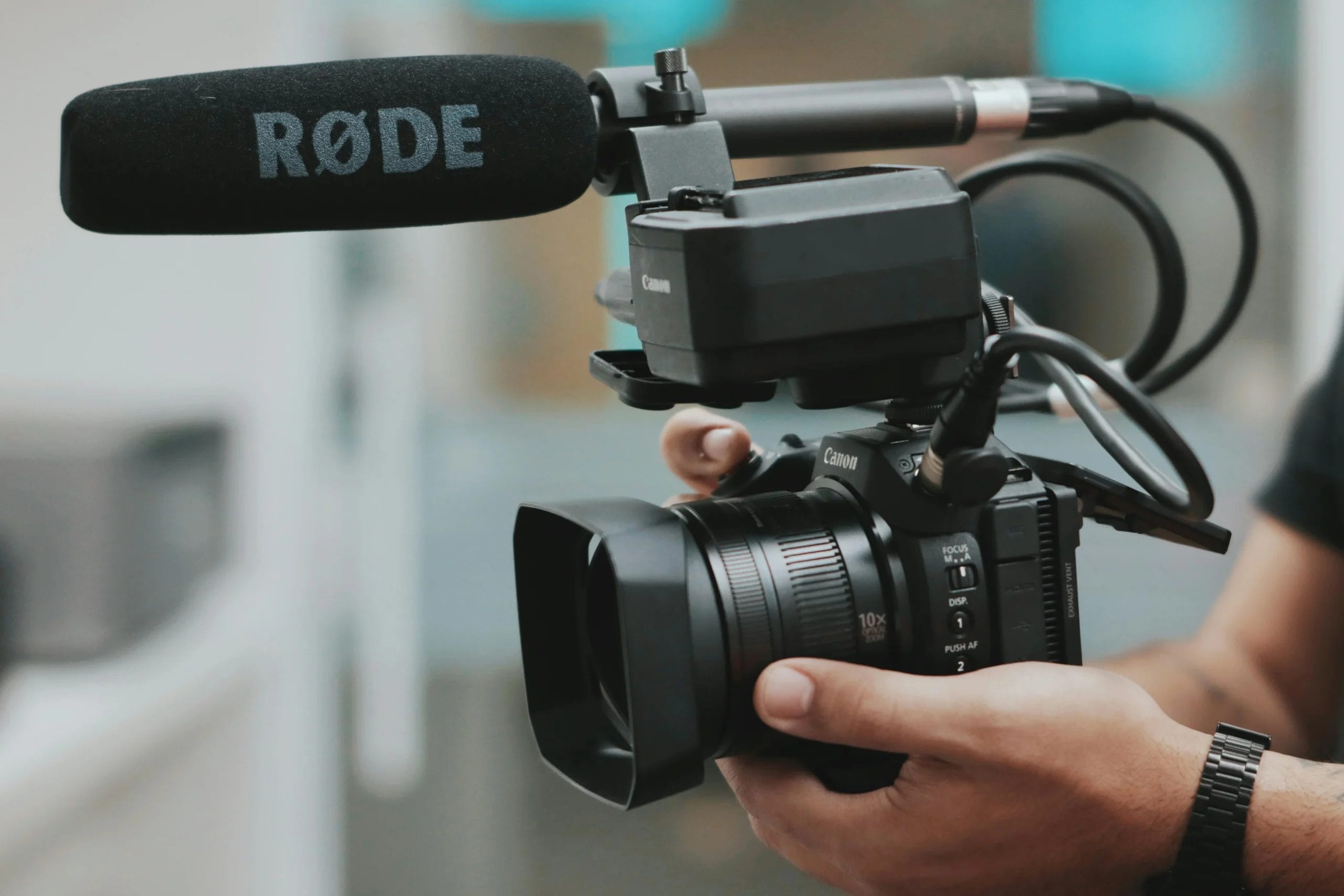 videographer positioning his camera for filming