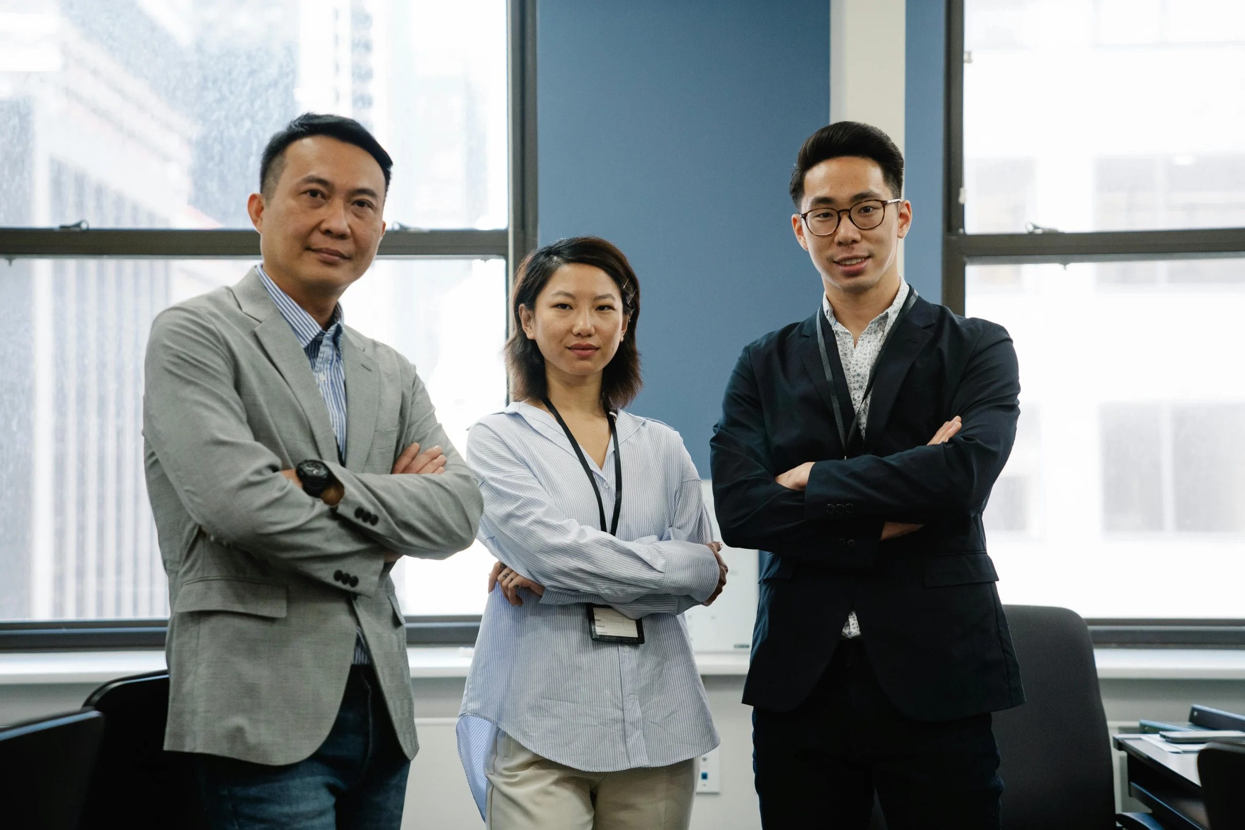 corporate shot in an office of 3 office workers