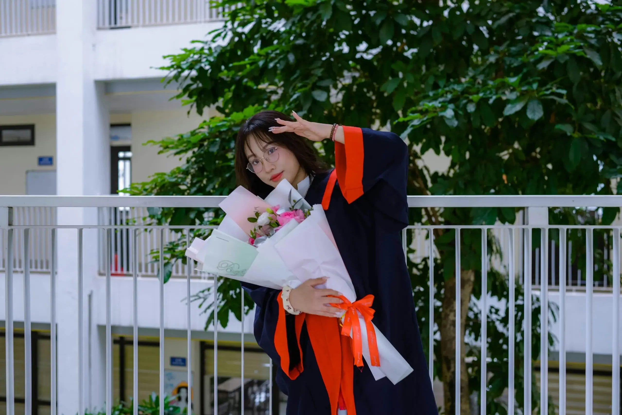 graduation celebration with bouquet in an outdoor photoshoot in singapore